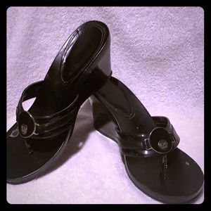 Black wedge sandals by BCBG.
